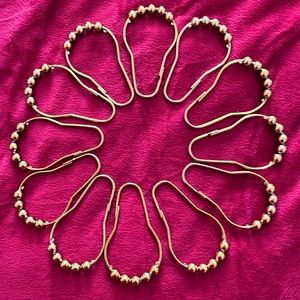Set of 12 gold tone shower curtain rings